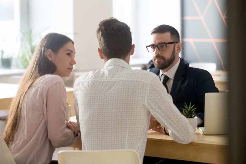 Man And A Woman Consulting With Another Man